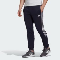 Брюки Essentials Fleece Tapered Cuff 3-Stripes adidas Sportswear adidas